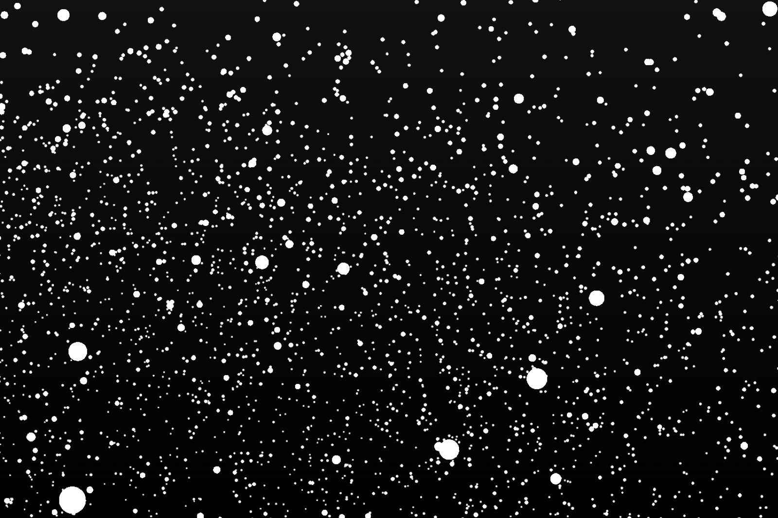 Thousands of white particles at different sizes and depths on a dark background