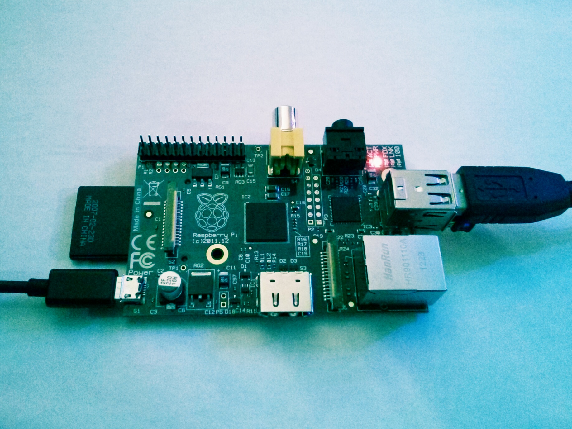 Raspberry Pi Model B connected to power, video and USB cables